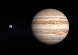 木星と地球（左）のサイズ比較図。