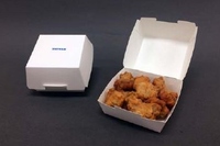 凸版印刷が開発した中食・惣菜製品向けの耐油性紙容器のサンプル（同社発表資料より）