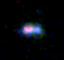 アルマ望遠鏡が捉えた132億光年の距離にある銀河MACS0416_Y1の観測画像。(c) ALMA (ESO/NAOJ/NRAO) NASA/ESA Hubble Space Telescope, Tamura et al.