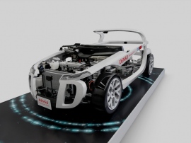 トヨタは主要な電子部品事業をデンソーに集約する方向で動いていたが、デンソーはトヨタ半導体開発を担う合弁会社を設立する。写真は自動車内部のECUやインバータなどが、何処にどのように配置され、どのような役割を果たしているのかを展示した模型