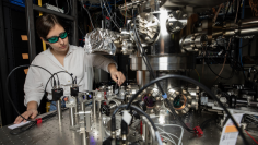 GTRI Research Scientist Darian Hartsell makes adjustments to an improved cryogenic vacuum chamber that helps reduce some common noise sources by isolating ions from vibrations and shielding them from magnetic field fluctuations. (Gtri.gatech.edu)