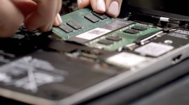 Technician installing memory in Framework Laptop 13 Pro (Frame.work)