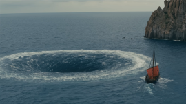 Odysseus and his men row hard against the Charybdis in a scene of the upcoming film, the Odyssey. (Universalpictures.com)