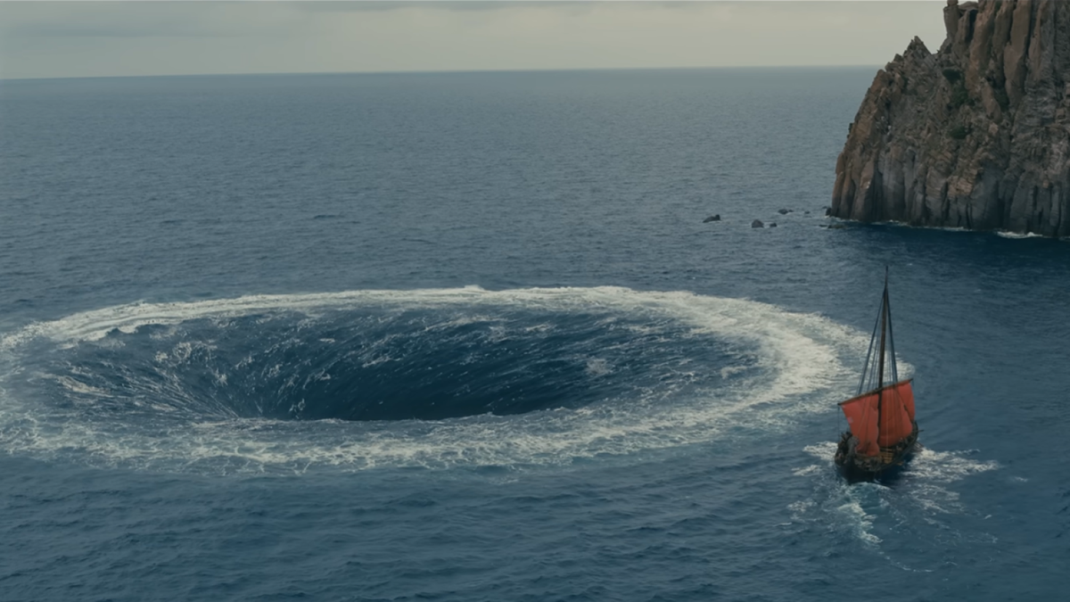 Odysseus and his men row hard against the Charybdis in a scene of the upcoming film, the Odyssey. (Universalpictures.com)