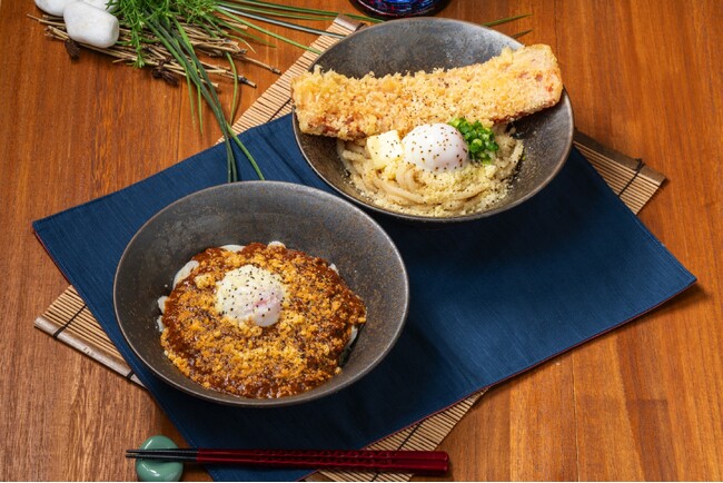 特大ベーコン天の塩味とバターの風味が癖になるうどんと、カレー×ボロネーゼの贅沢な風味が食欲そそるうどん2種期間限定で発売！ 『ベーコン天と温玉の釜バター醤油うどん』・『カレーボロネーゼうどん』が新発売