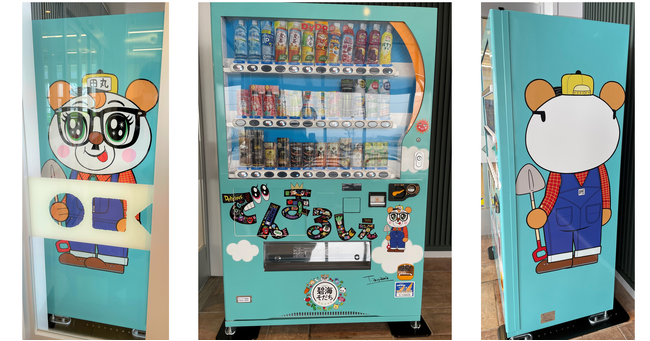 自動販売機を通じて三河地域を盛り上げる！「でんまるしぇ」に「田丸シェ太郎ラッピング自動販売機」を設置