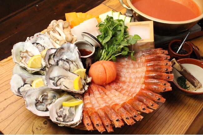 大阪心斎橋で生牡蠣と赤海老を濃厚出汁で味わう！えび牡蠣しゃぶしゃぶにトマトえび出汁が2025年5月に新登場！